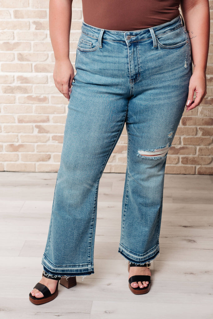 Judy Blue Mid Rise Distressed Released Hem Bootcut Jeans: 13/31