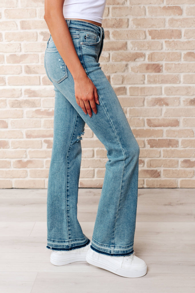 Judy Blue Mid Rise Distressed Released Hem Bootcut Jeans: 13/31