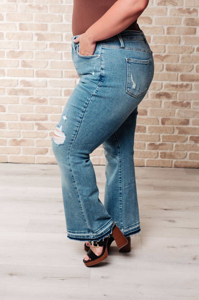 Judy Blue Mid Rise Distressed Released Hem Bootcut Jeans: 13/31